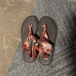 Sanuk Brown Flip Flops with Red Patterned Straps